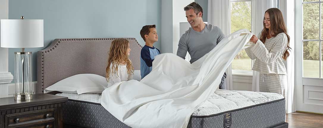 Image of family on mattress
